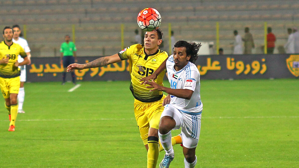 Al Wasl’s Rashed Ali and Baniyas’ Ahmed Mohamed Mubarak in action during the Arabian Gulf League football match at Zabeel Stadium on Friday. 