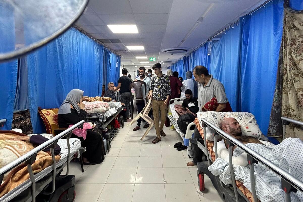 Patients and internally displaced people are pictured at Al-Shifa hospital in Gaza City on November 10, 2023. Photo: AFP