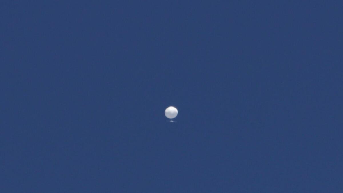 A balloon floats over Columbia, Mo., on Friday. A huge, high-altitude Chinese balloon sailed across the US on Friday, drawing severe Pentagon accusations of spying despite China's firm denials. — AP