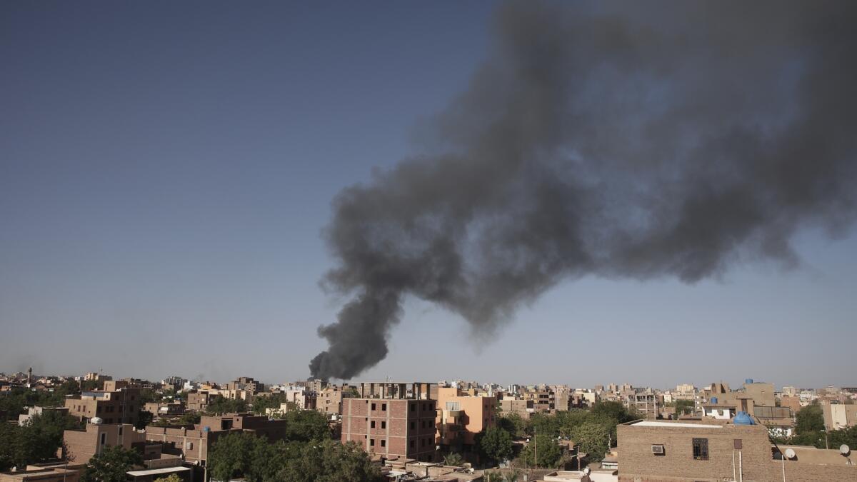 Smoke is seen in Khartoum, Sudan. — AP