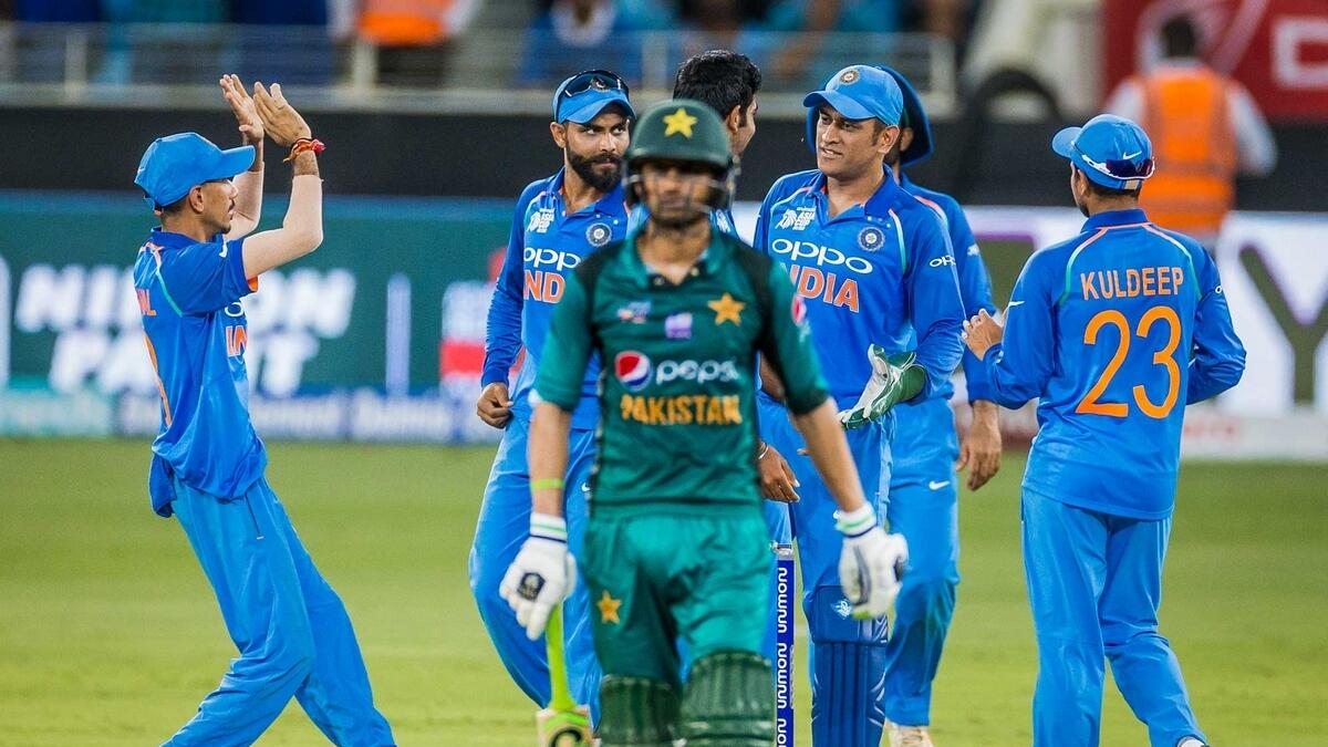 Indias Bumrah celebrates after dismissing Pakistan’s Malik during the Asia Cup match in Dubai International Cricket Stadium.-Photo by Neeraj Murali