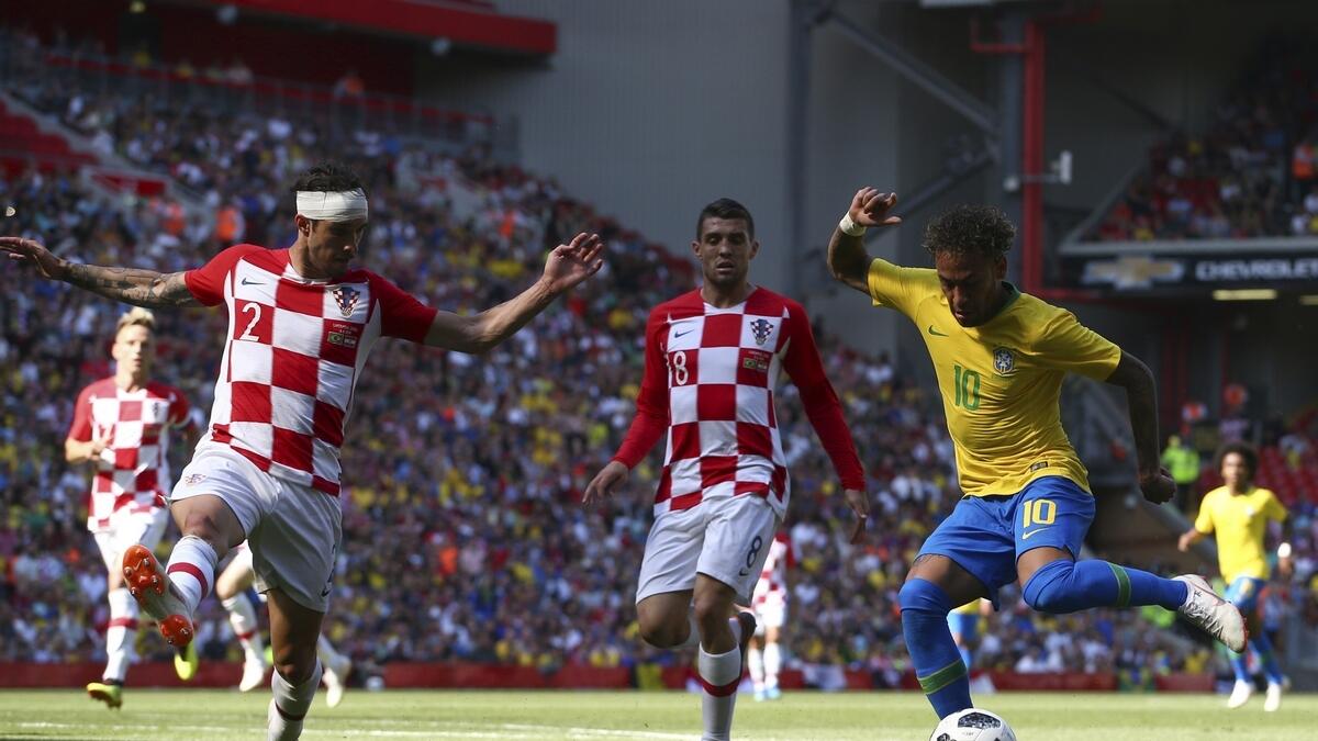 Brazil's Neymar (right) battles for the ball with Croatia's Sime Vrsaljko (left) and Croatia's Mateo Kovacic during the friendly match