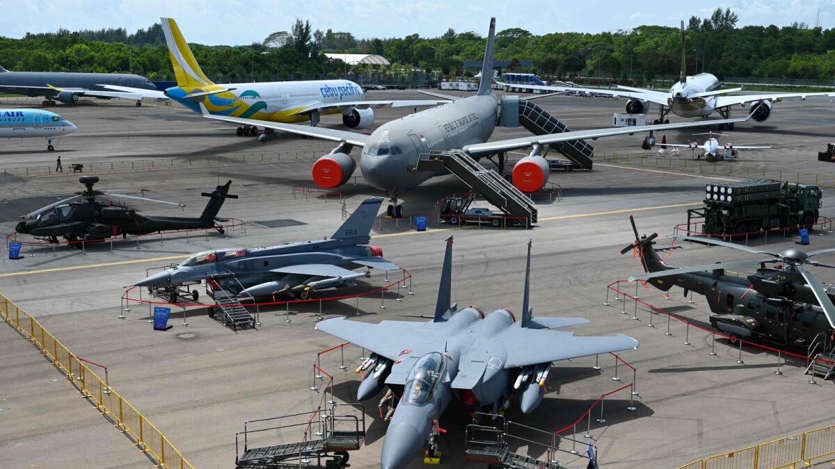 Military and commercial aircraft are seen on static display during a preview of the Singapore Airshow in Singapore. — AFP