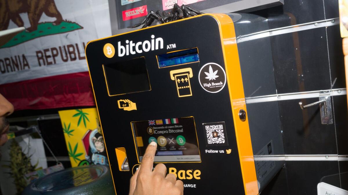 A Bitcoin ATM in Barcelona,. Despite trillions of dollars of losses, a batch of bankruptcies and one very high profile arrest, blockchain’s devotees remain devoted. (Samuel Aranda/The New York Times)