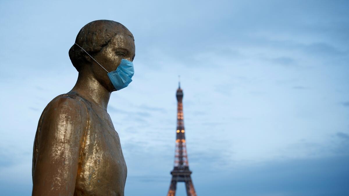 Golden Statue at the Trocadero square near the Eiffel tower wears a protective mask during the outbreak of the coronavirus disease (COVID-19) in Paris, France, May 2, 2020.