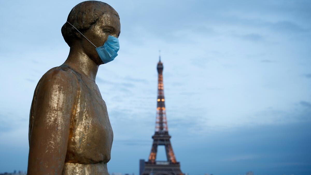 Golden Statue at the Trocadero square near the Eiffel tower wears a protective mask during the outbreak of the coronavirus disease (COVID-19) in Paris, France, May 2, 2020.