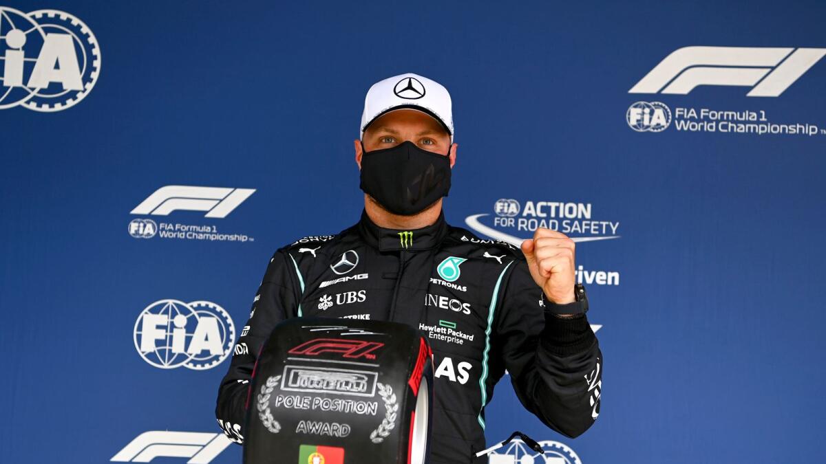 Mercedes driver Valtteri Bottas of Finland poses after he clocked the fastest time during the qualifying session ahead of the Portugal Formula One Grand Prix at the Algarve International Circuit near Portimao, Portugal. — AP