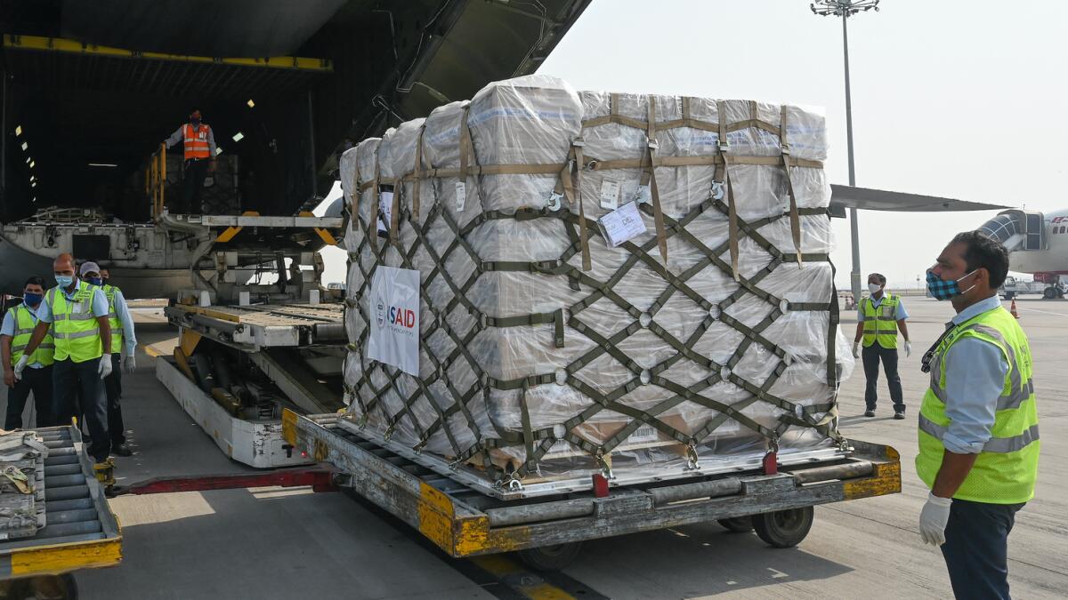 Medical supplies from the US being unloaded in Delhi. Photo: AFP
