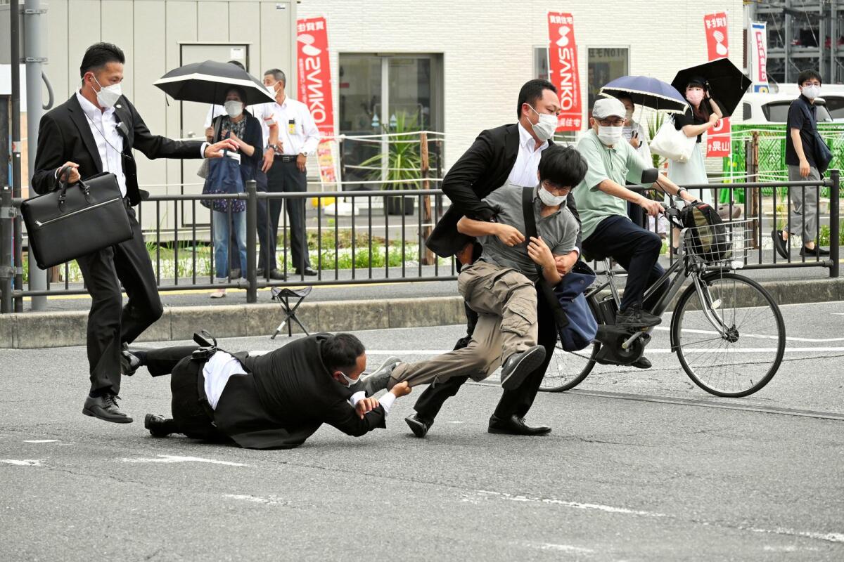 This image shows a man suspected of shooting former Japanese prime minister Shinzo Abe being tackled to the ground by police at Yamato Saidaiji Station in the city of Nara on July 8, 2022 (Photo: AFP)