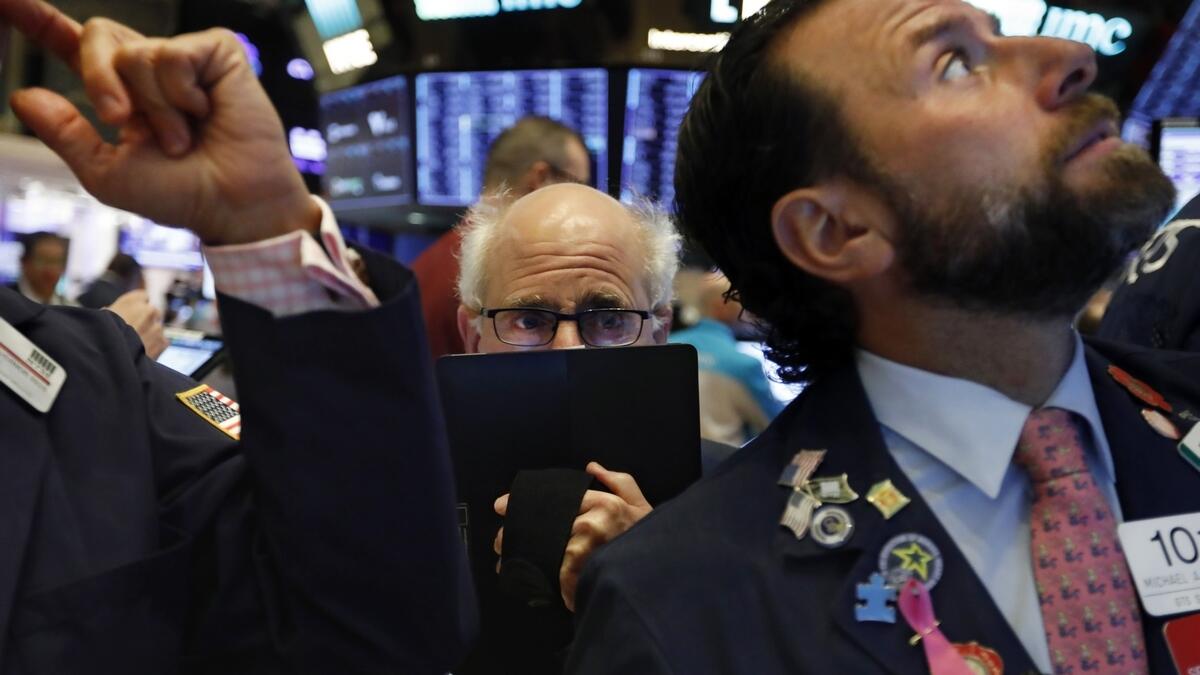 Wall St bogged down by China virus fears, Intel limits losses