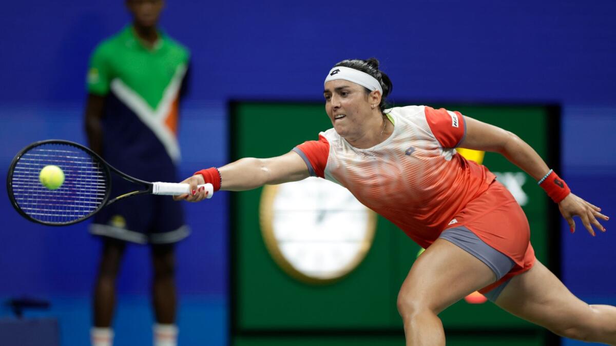 Tunisia' Ons Jabeur reaches out to make a return to Veronika Kudermetova during the fourth round. — AP