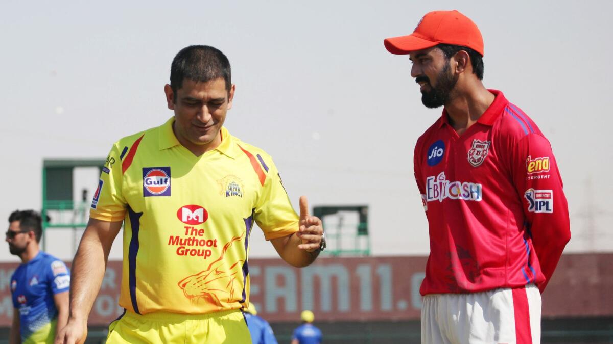 MS Dhoni and KL Rahul during the toss on Sunday. — IPL
