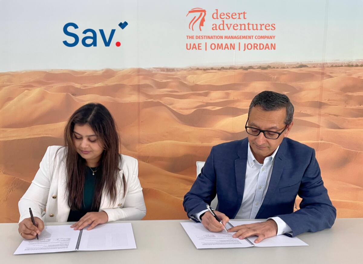 Purvi Munot, Co-founder and CEO at Sav and Samir Mehta, COO at Desert Adventures, sign the pact. — Supplied photo