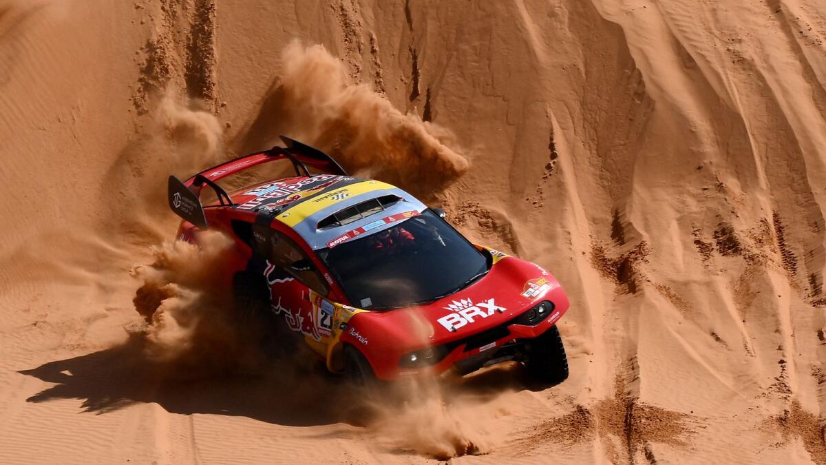 French driver Sebastien Loeb and co-driver Fabian Lurquin of Belgium compete in the Dakar Rally. (AFP)