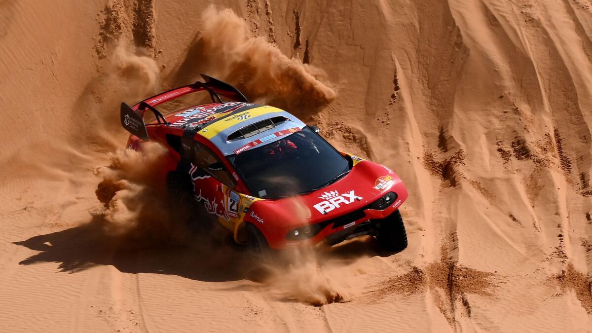 French driver Sebastien Loeb and co-driver Fabian Lurquin of Belgium compete in the Dakar Rally. (AFP)