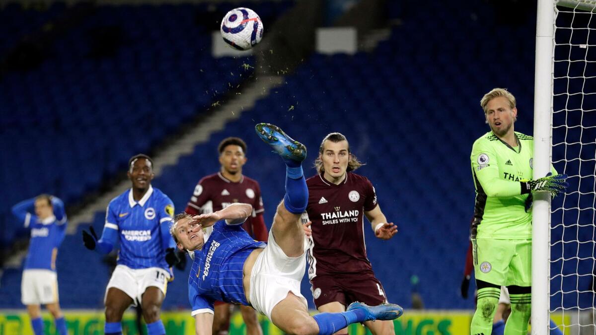 Brighton's English defender Dan Burn keeps the ball in play during the English Premier League match against Leicester City. — AFP