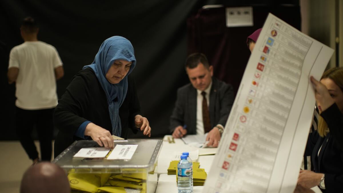A woman votes at a polling station in Istanbul, Turkey.