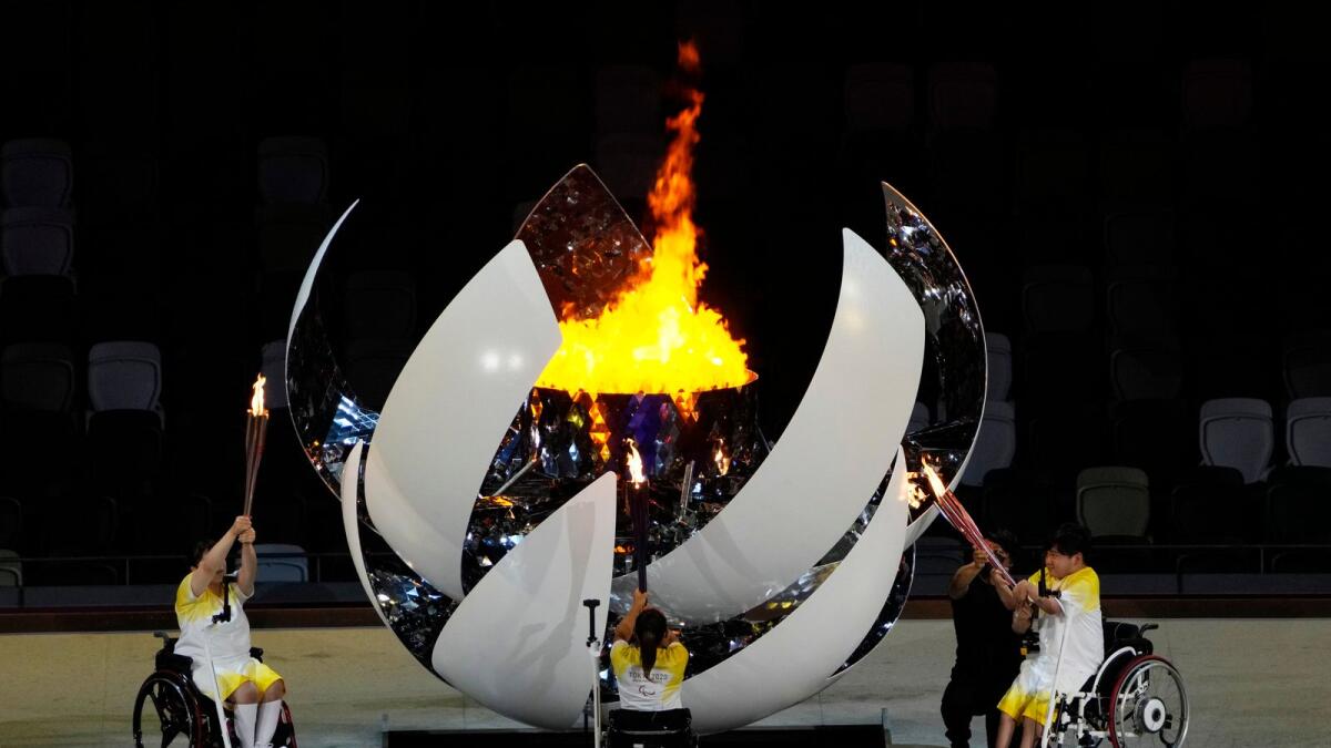 Athletes light the Paralympic cauldron during the opening ceremony. (AP)