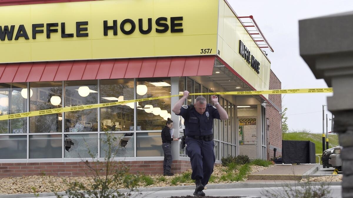 Law enforcement officials work the scene of a fatal shooting at a Waffle House in the Antioch neighborhood of Nashville.-AP