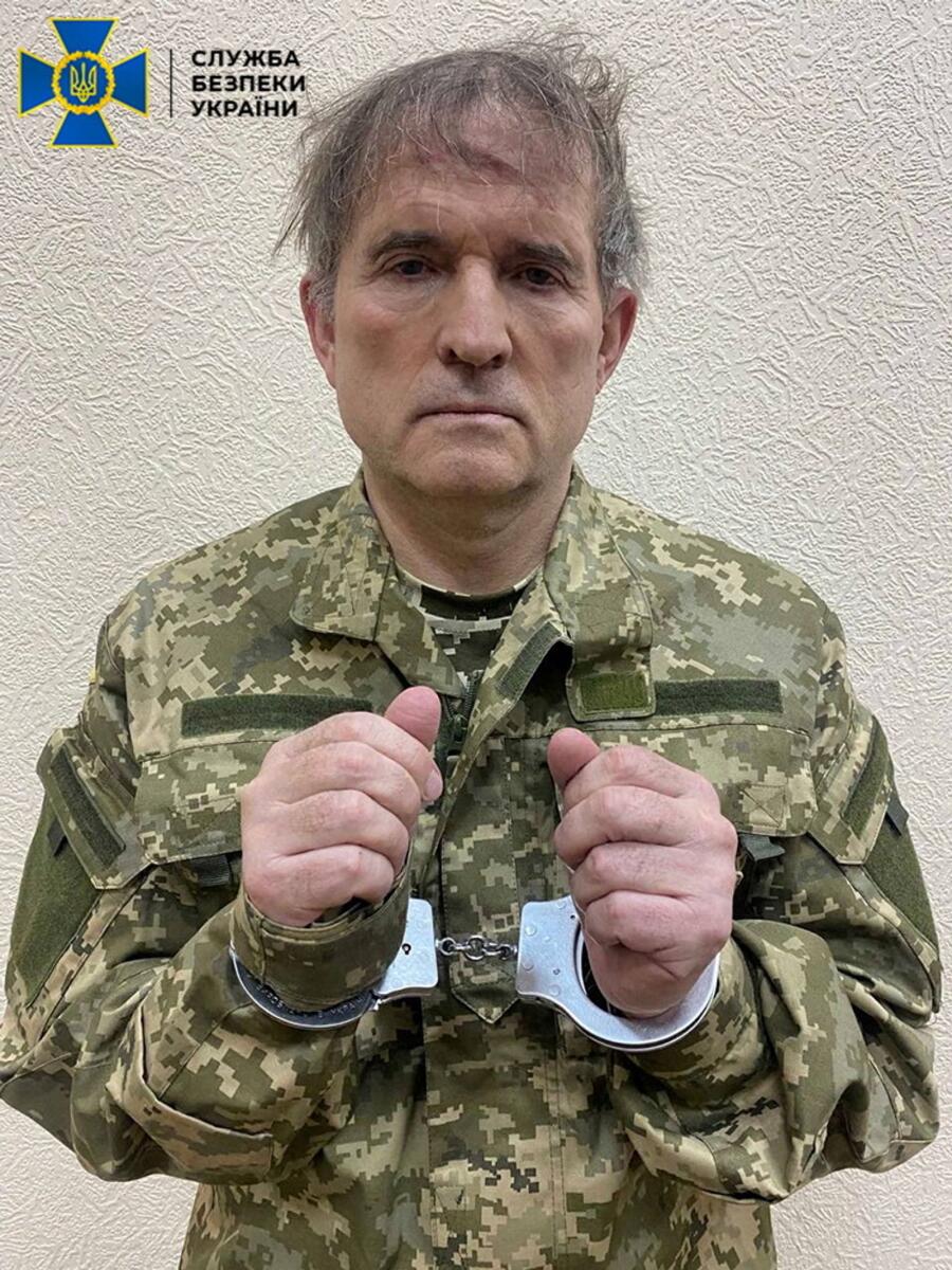 Viktor Medvedchuk is seen in handcuffs while being detained by security forces in unknown location in Ukraine. (Reuters)