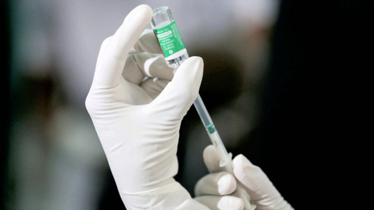 A health official draws a dose of AstraZeneca's Covid-19 vaccine manufactured by the Serum Institute of India. — Reuters