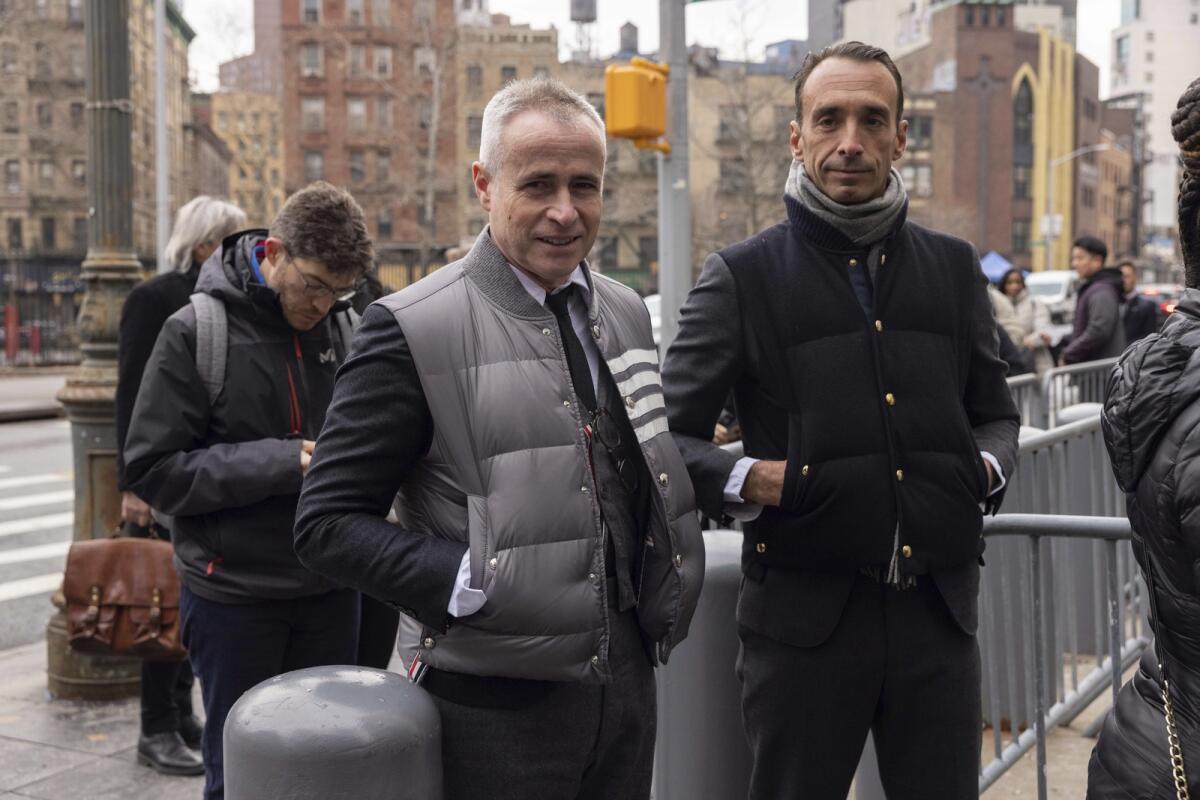 Fashion designer Thom Browne waits in line outside Manhattan federal court, Monday, Jan. 9, 2023, in New York