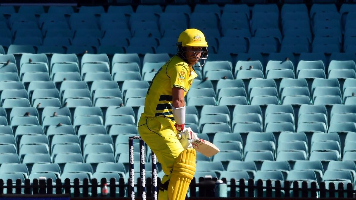 Australia's batsman David Warner bats  in front of an empty grandstand during the first one-day international match against New Zealand in Sydney. (AFP)
