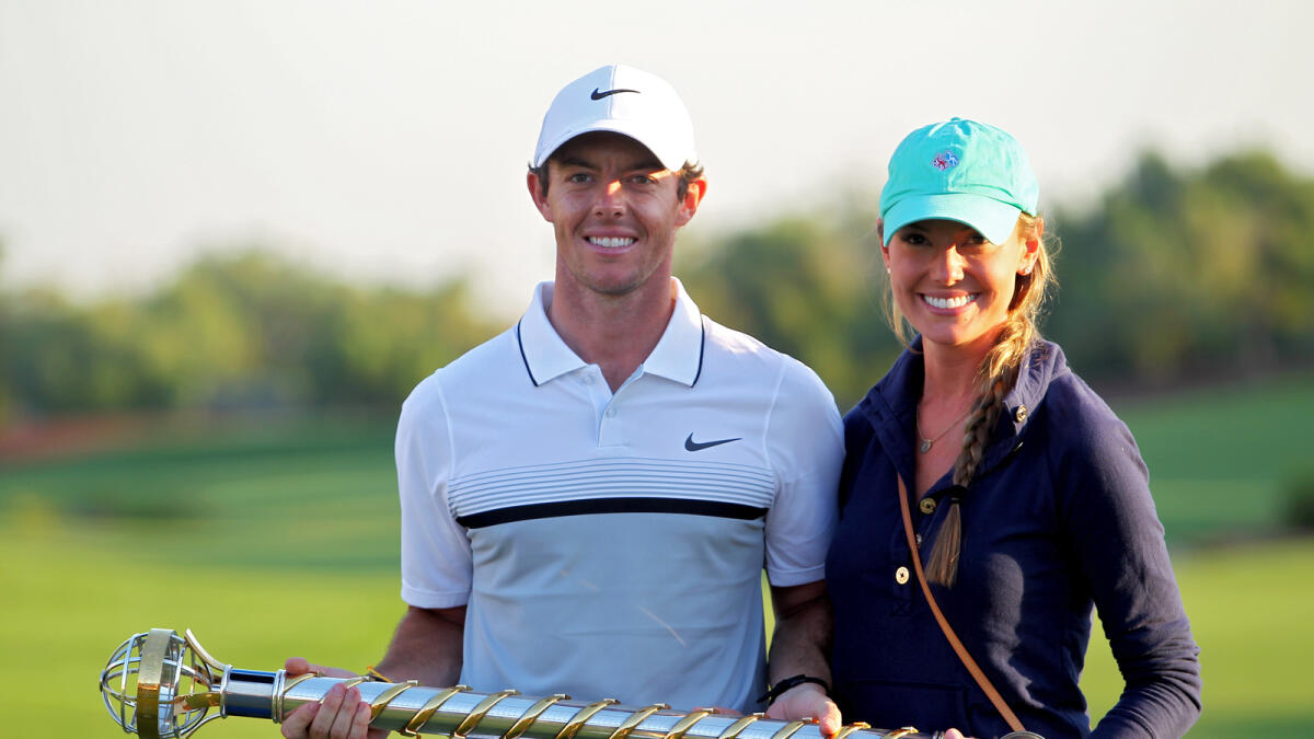 SP221115-RG-GOLF. Rory McIlroy of Northern Ireland poses with his girlfriend Erica Stoll and the DP World Tour Championship and Race to Dubai trophy after his one shot win in the final round of the 2015 DP World Tour Championship on the Earth Course at Jumeirah Golf Estates on 22nd Nov 2015. Photo By: Rahul Gajjar