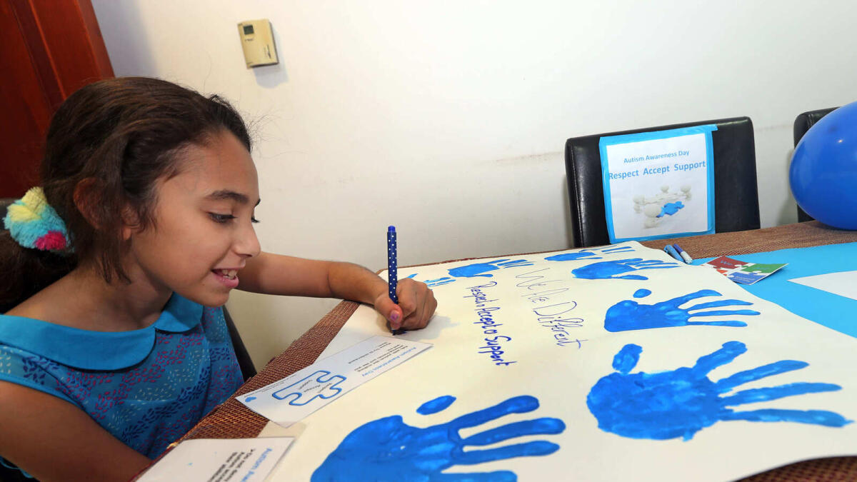 Sarah Hegazy preparing her How to Make a Difference project about autism in Dubai. —Photos by Dhes Handumon.