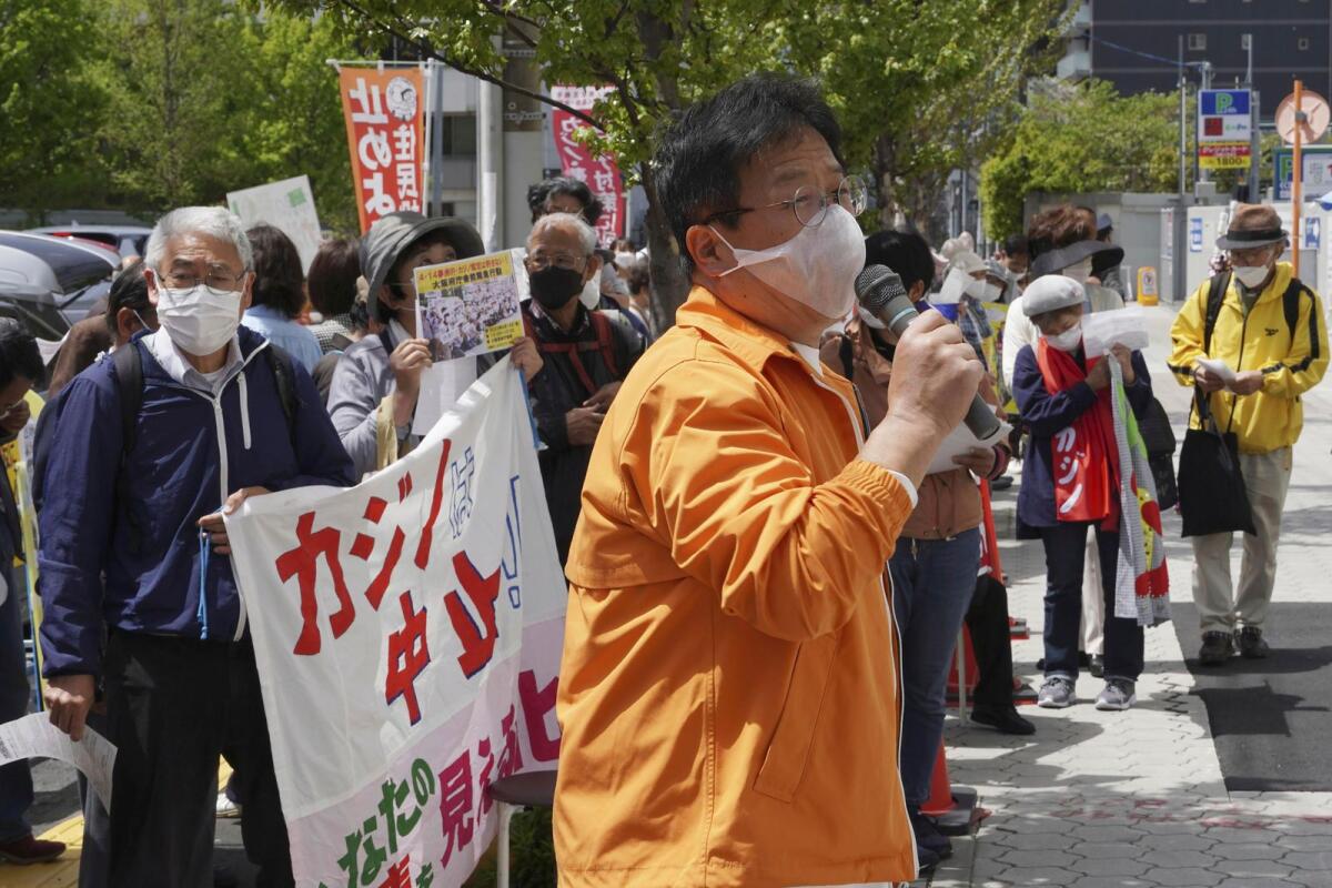 Protesters gather in front of Osaka prefectural head office in Osaka, western Japan, after Japan’s government approved a controversial plan to open its first casino in Osaka, on Friday. — AP