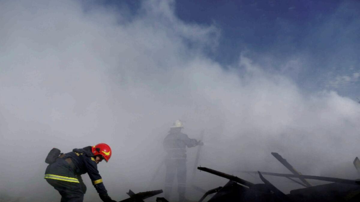 Ukrainian firefighters put out fire in a destroyed wholesale market after a Russian strike in Kramatorsk in Donetsk region. — Reuters