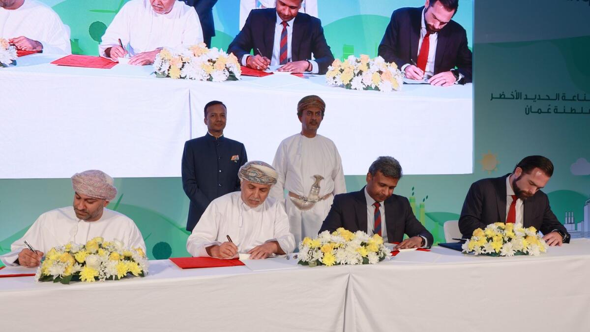 Eng. Ahmed bin Hassan Al Dheeb, Deputy Chairman of the Public Authority for Special Economic Zones and Free Zones, and Harssha Shetty, CEO of Jindal Shadeed Group, signing the agreement. — Supplied photo