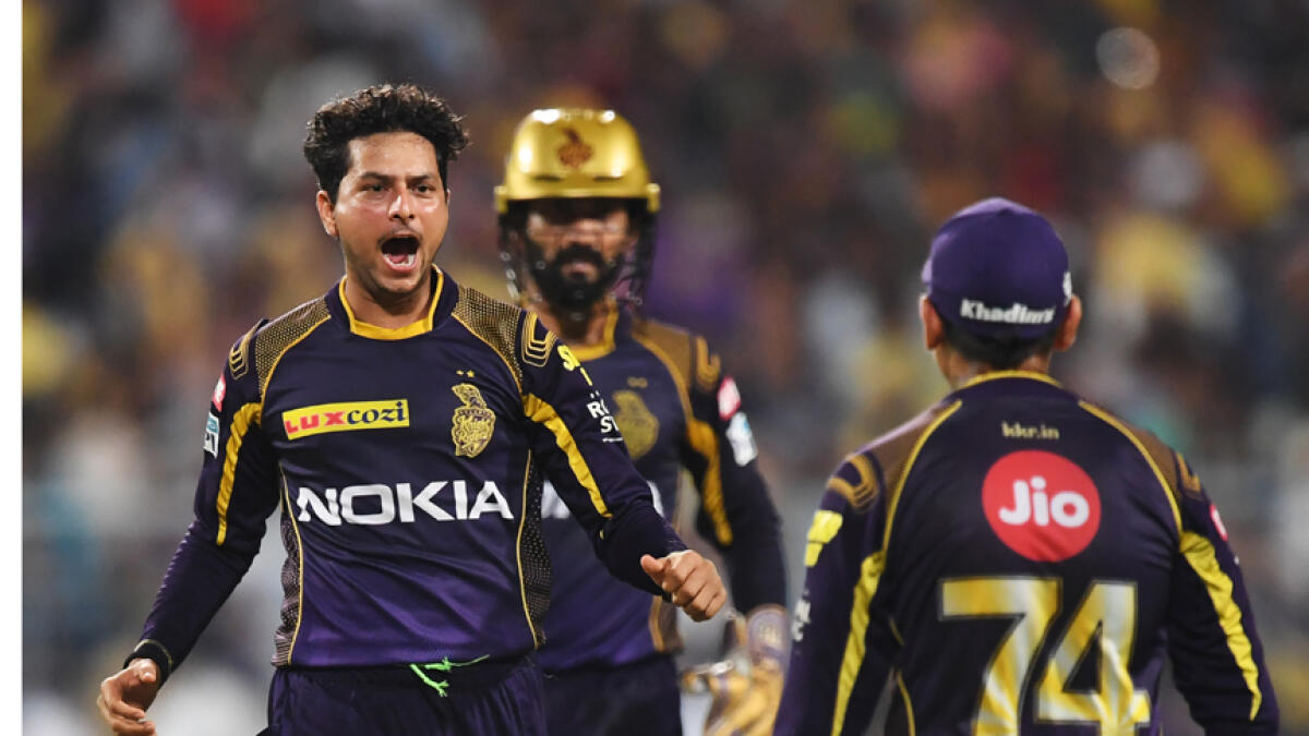 Kuldeep Yadav (left) is looked up to in the KKR ranks to deliver the goods. - AFP