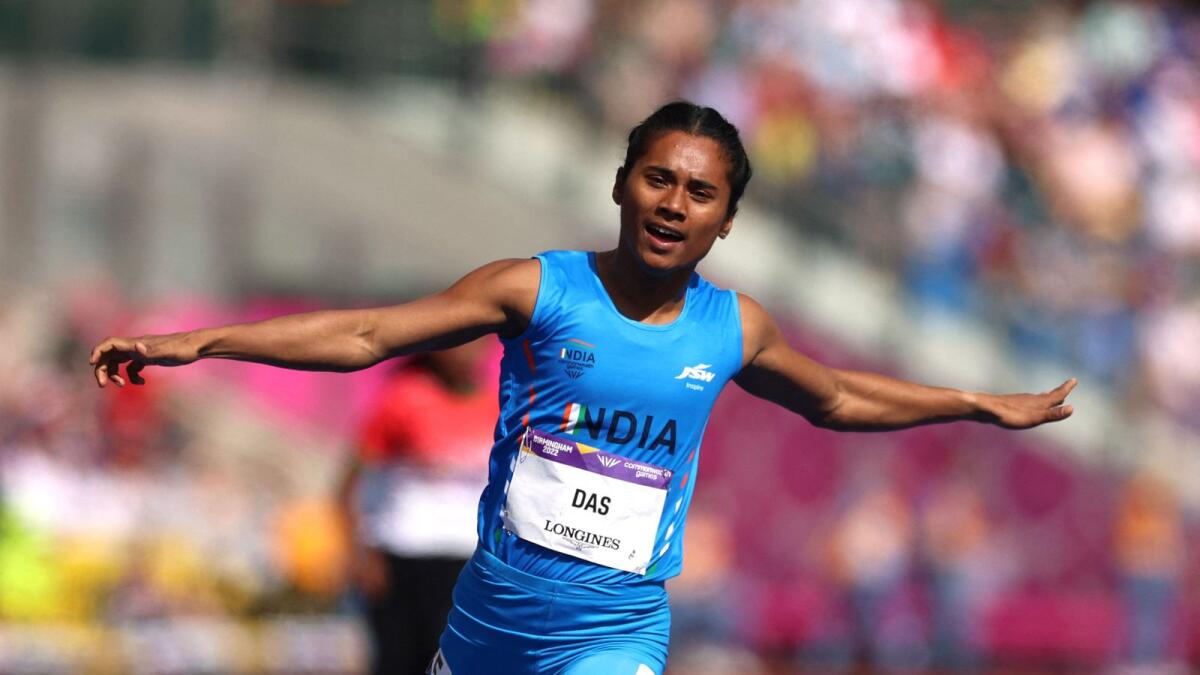 Hima Das celebrates after winning her heat at the Commonwealth Games. –Reuters