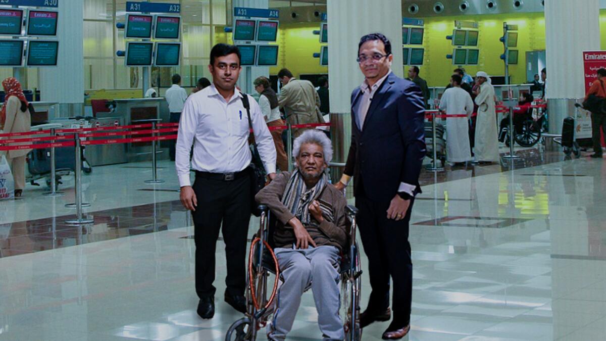 Farooq at the airport, with Baharul, accommodation supervisor, and Ravi Santiago.