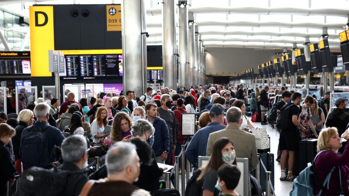 Passengers queue inside the departures terminal of Terminal 2 at Heathrow Airport, June 272. Photo: Reuters