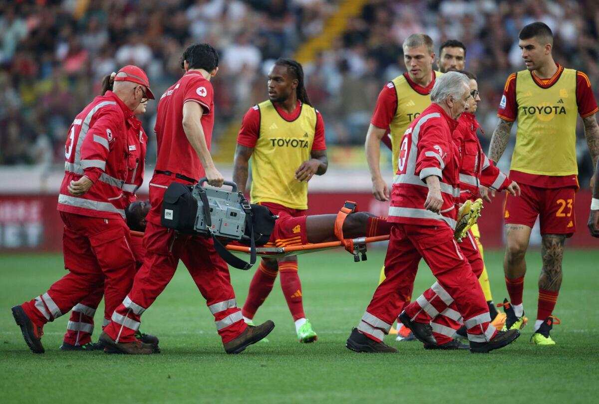 AS Roma's Evan Ndicka is stretchered off after collapsing on the pitch. —Reuters