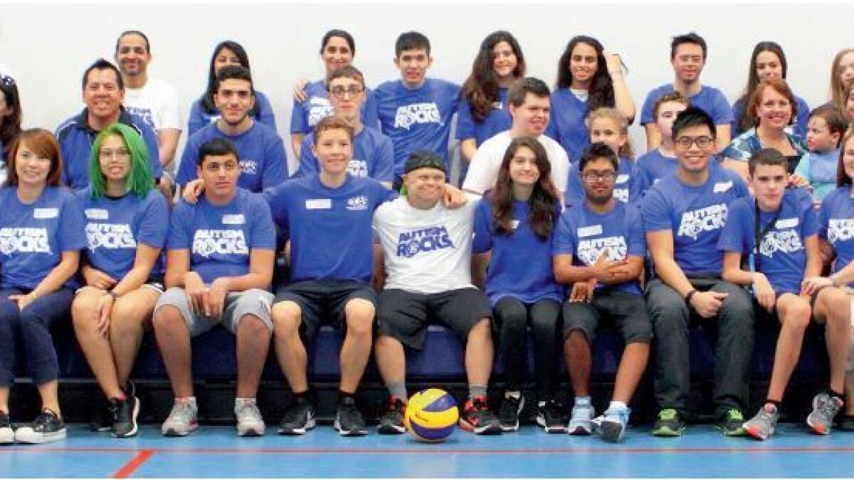 Volunteers of the Peer Power Rocks initiative with some autistic children. The initiative, supported by Autism Rocks, encourages the youth to volunteer and take part in sport activities with people with determination. — Supplied photo