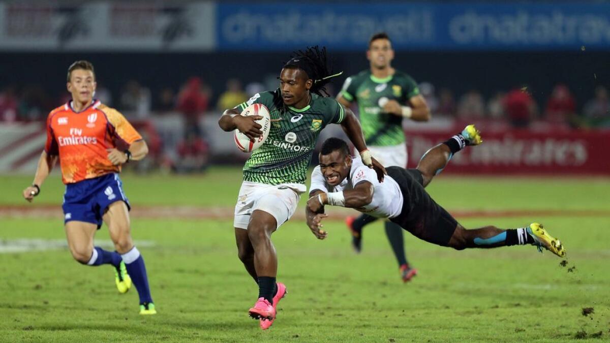 South Africa's Branco Du Preez being tackled by Fiji's Setareki Bituniyata  during their championship match at the Emirates Airline Dubai Rugby Sevens Championship at the Sevens Stadium in Dubai on Saturday.