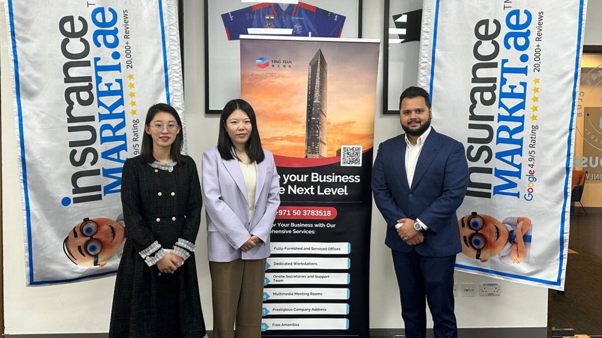 From L to R: Xiao Zhang, visa department supervisor, Liangjia Cheng, general manager, Yingtian Global with Avinash Babur, founder and CEO, InsuranceMarket.ae.