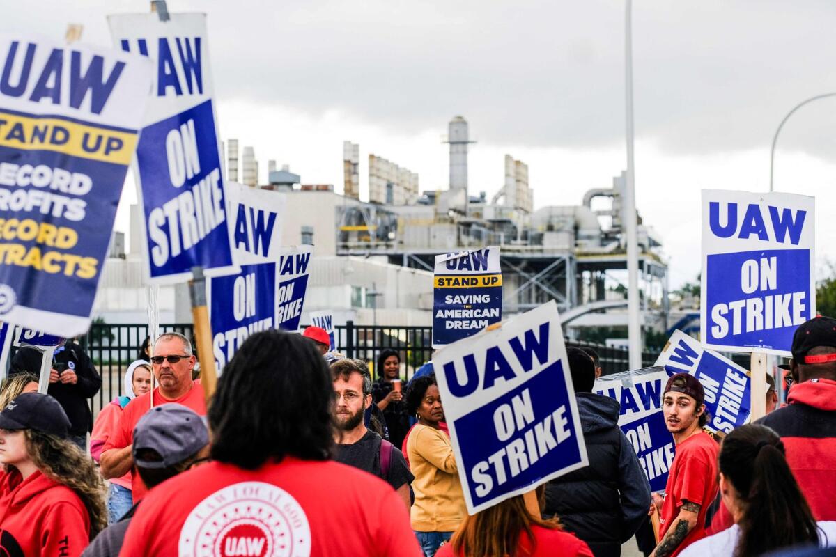 Members of the United Auto Workers (UAW) pickett outside of the Michigan Parts Assembly Plant in Wayne, Michigan, amid rumors that US President Joe Biden may stop by during his visit to Michigan to stand on the pickett lines with UAW workers in Detroit, Michigan, on September 26, 2023. — AFP