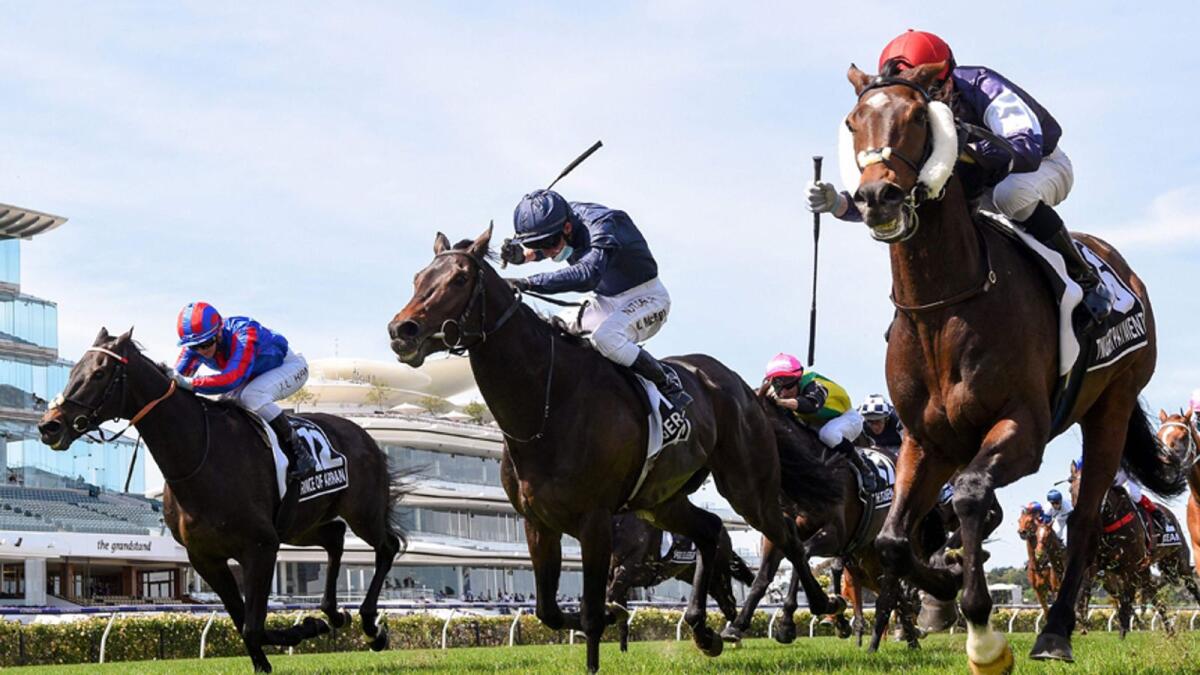 Twilight Payment ridden by Jye McNeil (right) on way to winning the Melbourne Cup at the Flemington Racecourse in Melbourne.— AFP