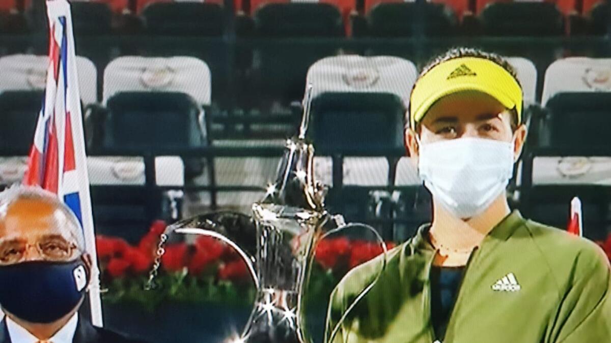 Garbine Muguruza with the Dubai Duty Free Tennis Championships trophy.