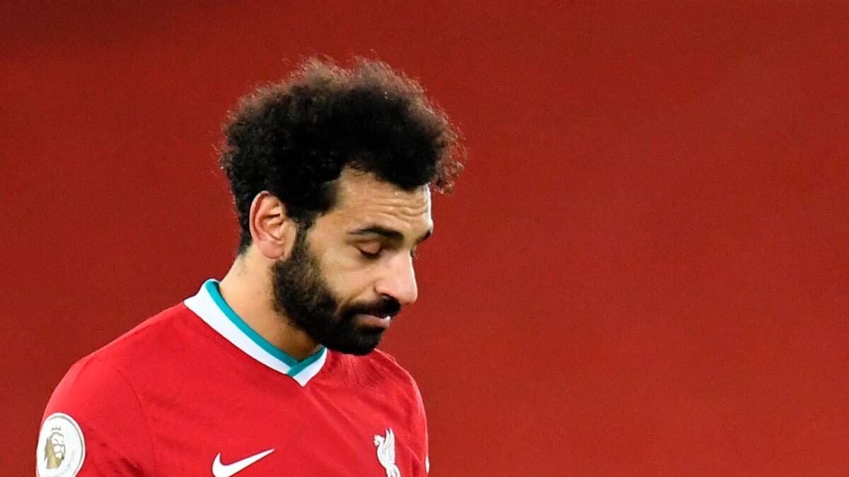 Liverpool's Mohamed Salah looks dejected after the match. — AFP