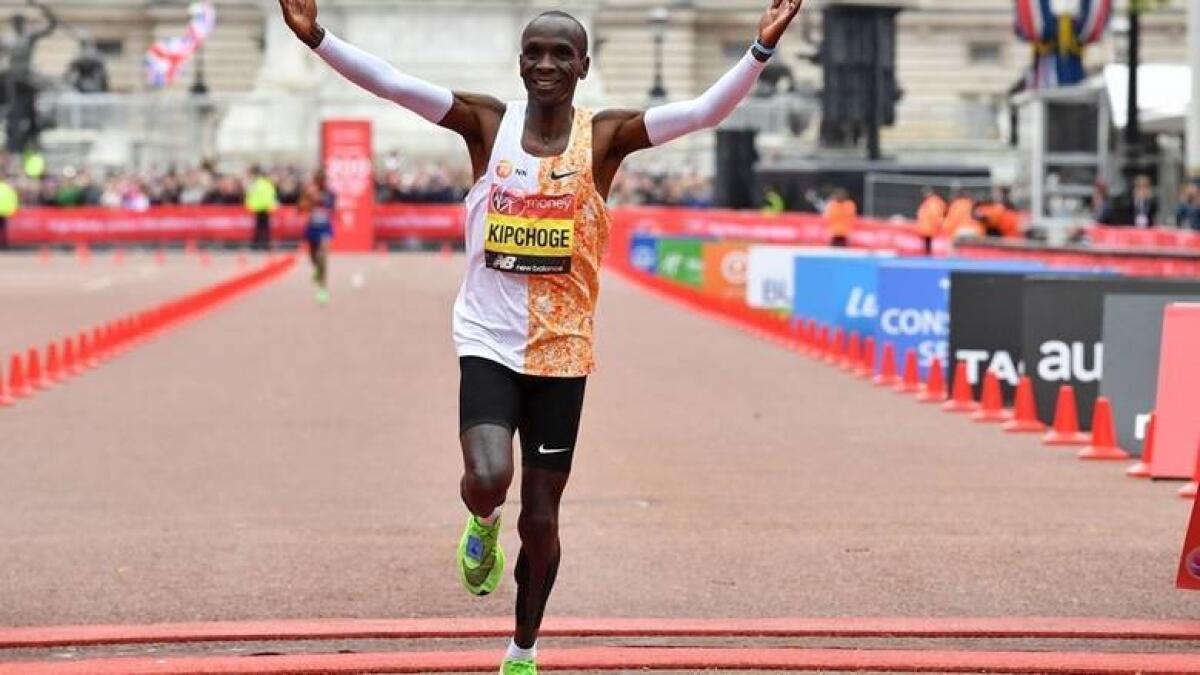 Kipchoge crosses the finish line to win the elite men's race of the 2019 London Marathon. - AFP file
