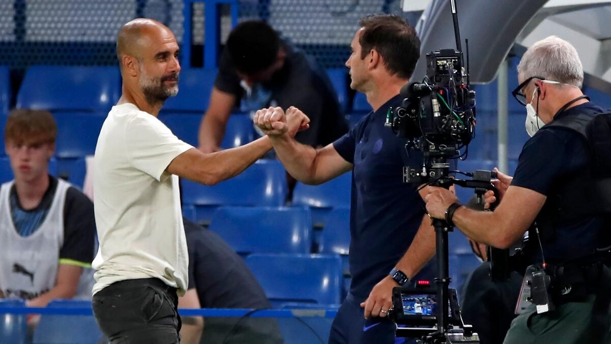 Pep Guardiola elbow bumps with Frank Lampard after during the  Premier League match