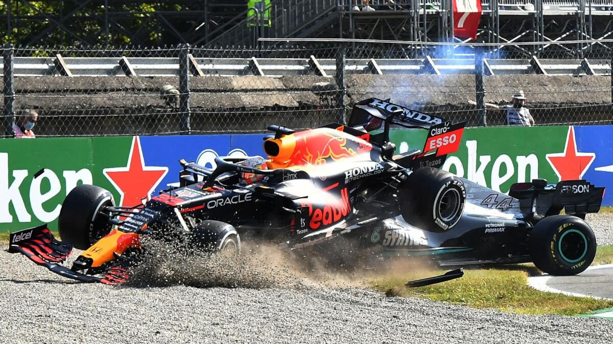 Red Bull's Max Verstappen and Mercedes' Lewis Hamilton crash out of the race. — Reuters