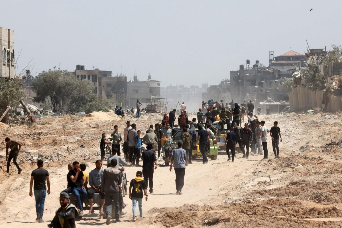 Palestinians who had taken refuge in Rafah, leave the city to return to Khan Yunis after Israel pulled its ground forces out of the southern Gaza Strip, on April 7, 2024. AFP