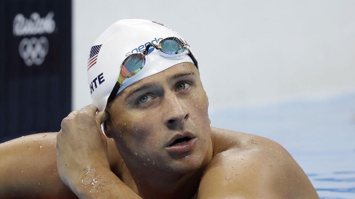 United States' Ryan Lochte checks his time in a men's 4x200-meter freestyle heat during the swimming competitions at the 2016 Summer Olympics, in Rio de Janeiro, Brazil.