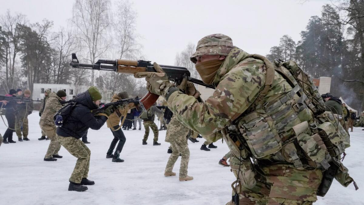 Members of Ukraine's Territorial Defense Forces, volunteer military units of the Armed Forces, train close to Kyiv, Ukraine. — AP